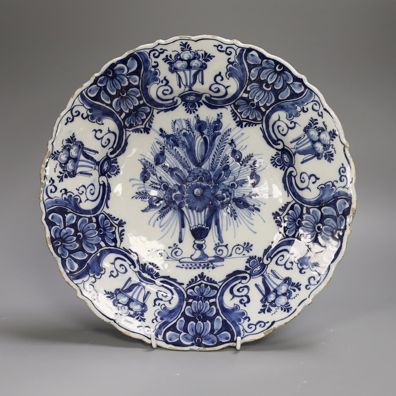 A mid 18th century Delft blue and white ‘flower urn’ dish, Claw Factory, 31cm